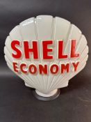 A 'Shell Economy' glass petrol pump globe stamped Hailware. Shell wording repainted.