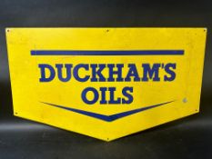 A Duckhams Oils printed tin advertising sign with amateur restoration, 27 1/2 x 16 3/4".