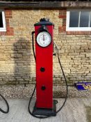 An Avery Hardoll round windowed electric petrol pump, recently restored to a high standard, base