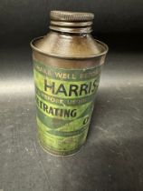 A Harris's Penetrating Oil cylindrical tin.