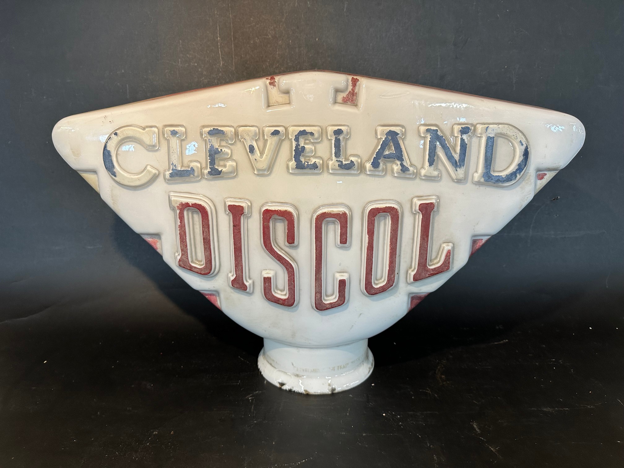 A Cleveland Discol petrol pump globe with raised lettering in original condition, some nibbling to