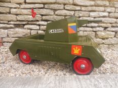A Triang Toys tinplate child's pedal car modelled as a military tank, original and untouched.