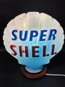 A Super Shell blue glass petrol pump globe stamped by Hailware, slight nibbling to neck.