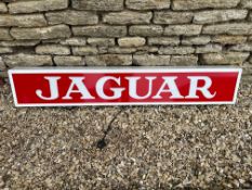 A contemporary Jaguar light-up sign with red vinyl on white acrylic panel, 59 3/4 x 9 3/4, depth 5