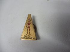 A Shell Lubricating Oil badge depicting Shell's Robotman aka Stickman.