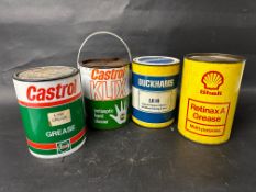Four grease tins to include Duckhams, Shell and Castrol.