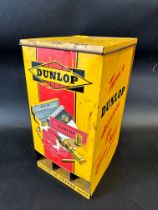 A Dunlop 'Silent Salesman' wall mounted tin cabinet dispensing cycle repair outfit tins.