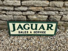 A contemporary Jaguar light-up sign with green lettering on white panel, 30 1/4 x 9 3/4", depth 3.
