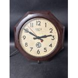 A Smiths Sectric dealer garage wall clock in octagonal bakelite frame with applied paper MG logo.