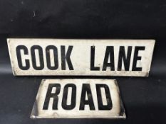 Two ceramic road signs for 'Cook Lane' (22" x 6") and 'Road' (11.5" x 6").