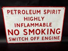 An embossed alloy garage sign 'Petroleum Spirit Highly Inflammable NO SMOKING Switch Off Engine',