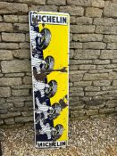 A Michelin Tyres vertical pictorial enamel advertising sign depicting Mr Bibendum rolling a tyre, 15