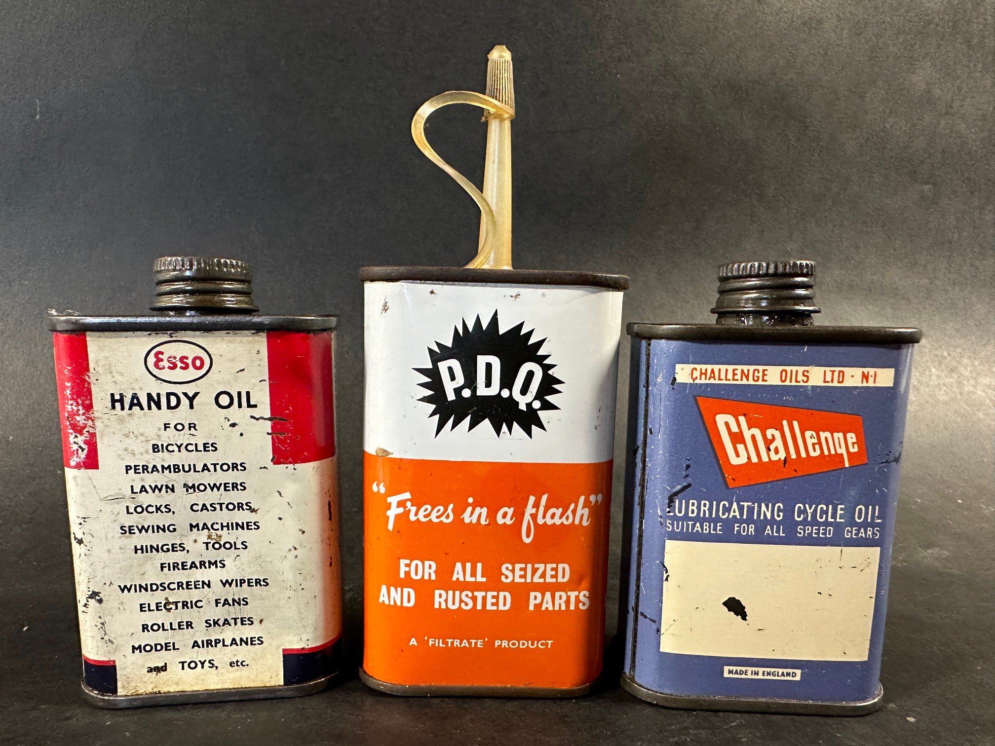 An Esso Handy Oil tin, a Challenge Lubricating Cycle Oil tin and a Filtrate P.D.Q. oil tin. - Image 2 of 3