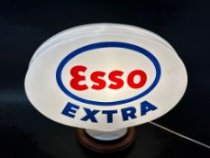 An Esso Extra plastic petrol pump globe, some chipping to neck.