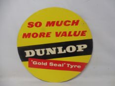 A Dunlop Tyres circular cardboard tyre insert sign: So much more value Dunlop 'Gold Seal' Tyre,