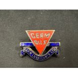 A Germ Oils enamel lapel badge, indistinctly stamped to verso.