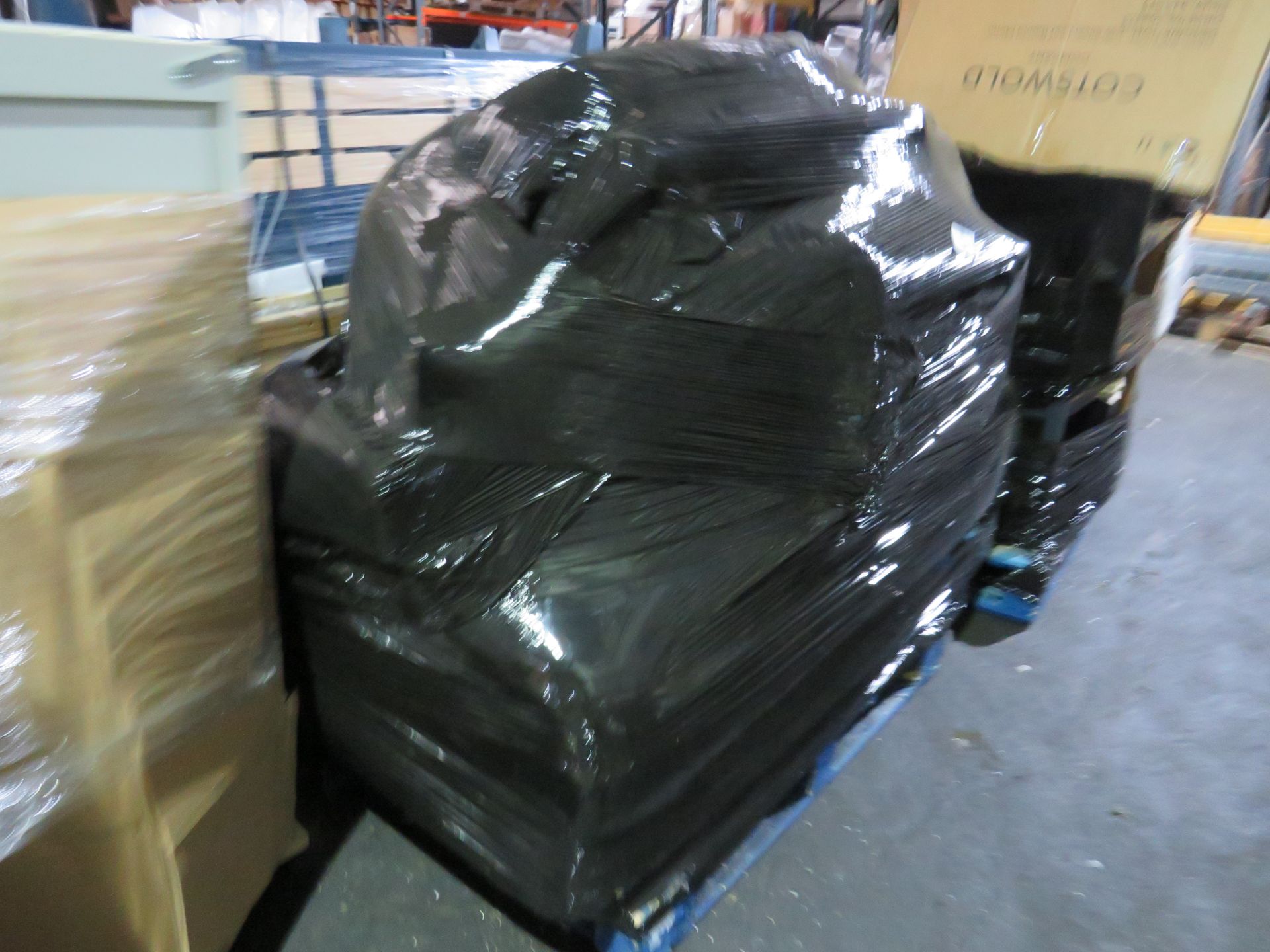 Pallet of unmanifested furniture parts. All unchecked