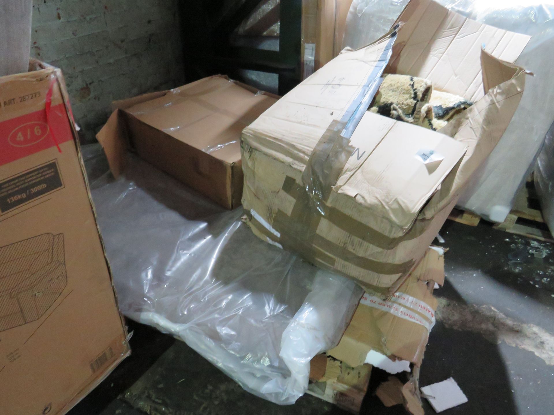 Pallet of unmanifested furniture parts. All unchecked