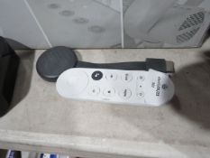 Google Chrome cast, no power cable and it comes with a white remote controlk which we arent sure