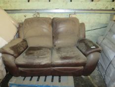 Pallet containing a Costco return 2 seater leather manual reclining sofa. This has been stored for a