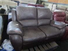 Costco Brown Leather 2 seater reclining sofa, has been used and has marks. Ideal for playroom etc