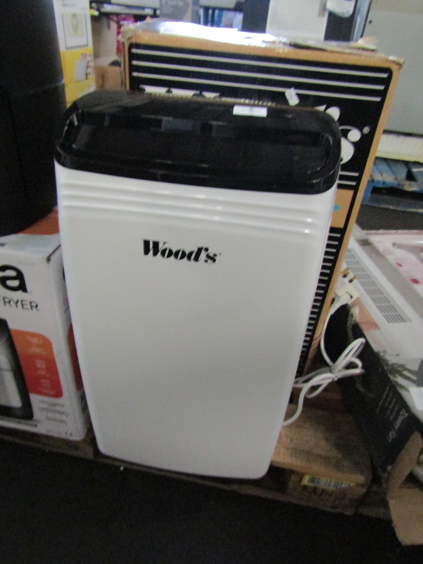 Woods MDK26 dehumidifier, comes with original box, the items powers up and appears to work but we