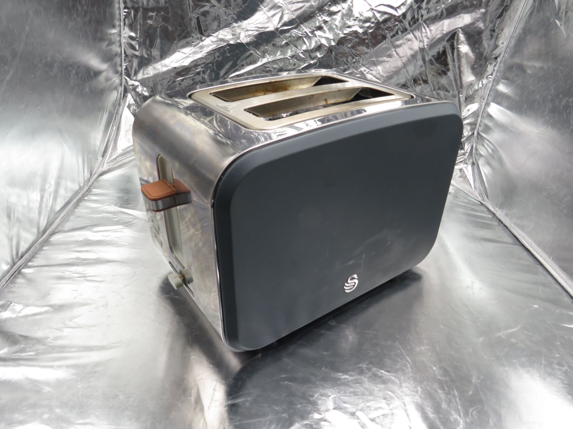Swan 2 slice toaster, has been used but is working as in the elements heat up, comes with original
