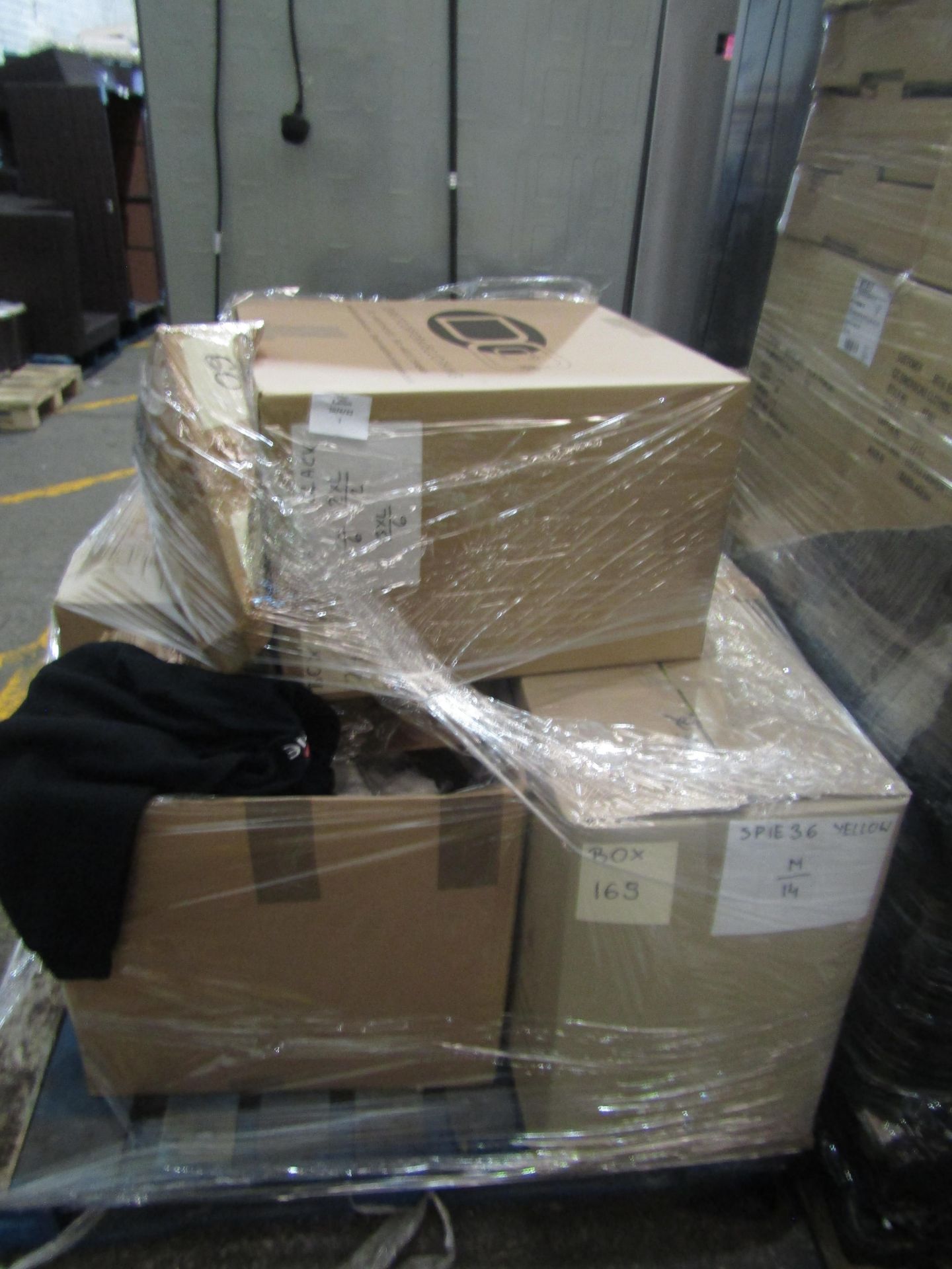 A pallet of Spie Branded workwear