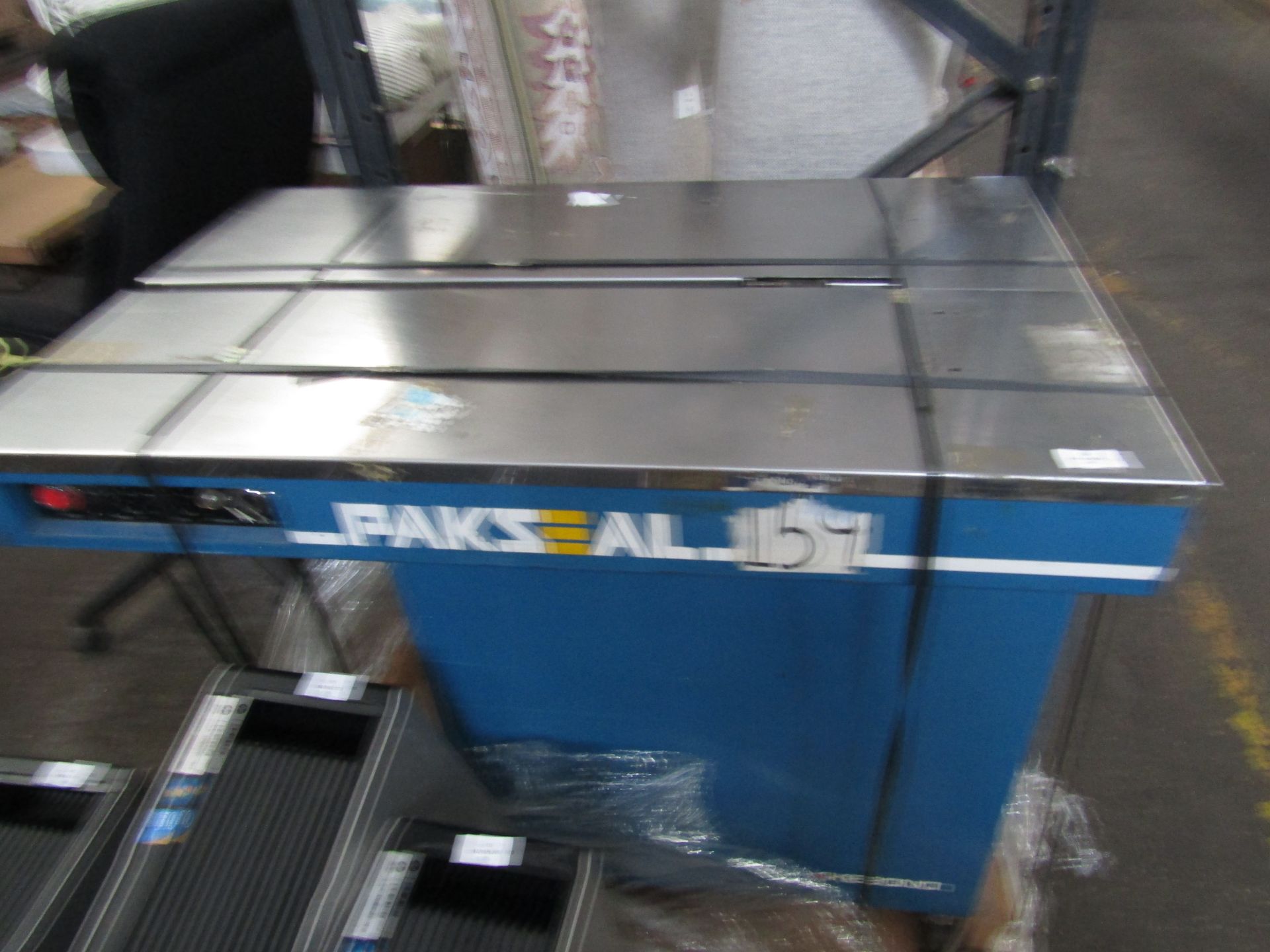 Paksesl table banding Machine, working with a roll of banding already in it.