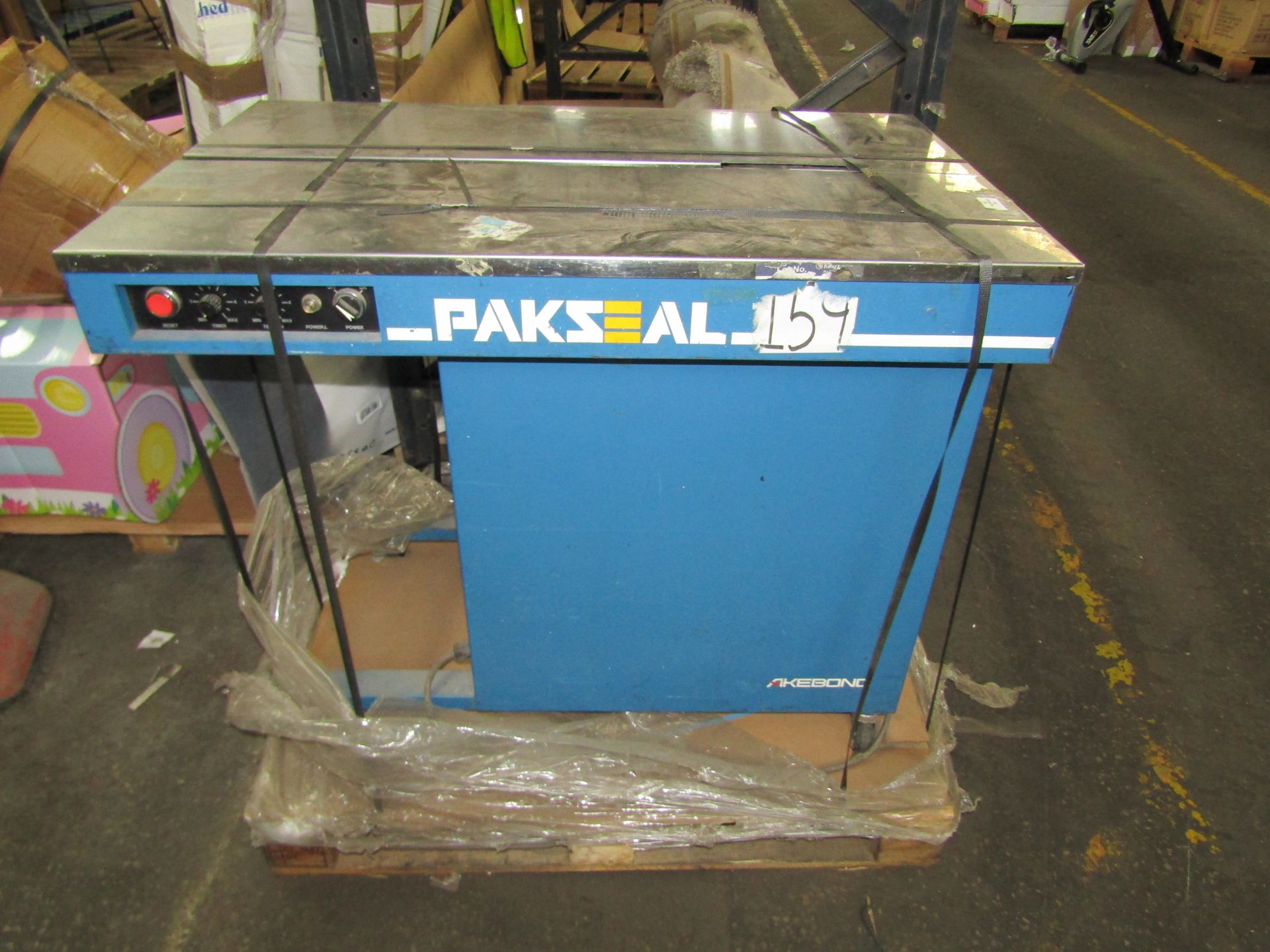 Pakseal Single Phase Table Banding Machine, working with a roll of banding already in it. (