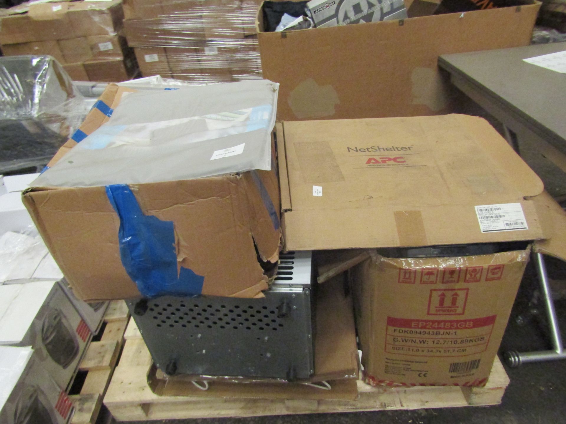 sm all pallet of unchecked items with include a large ice maker, a table too ice maker, a box of