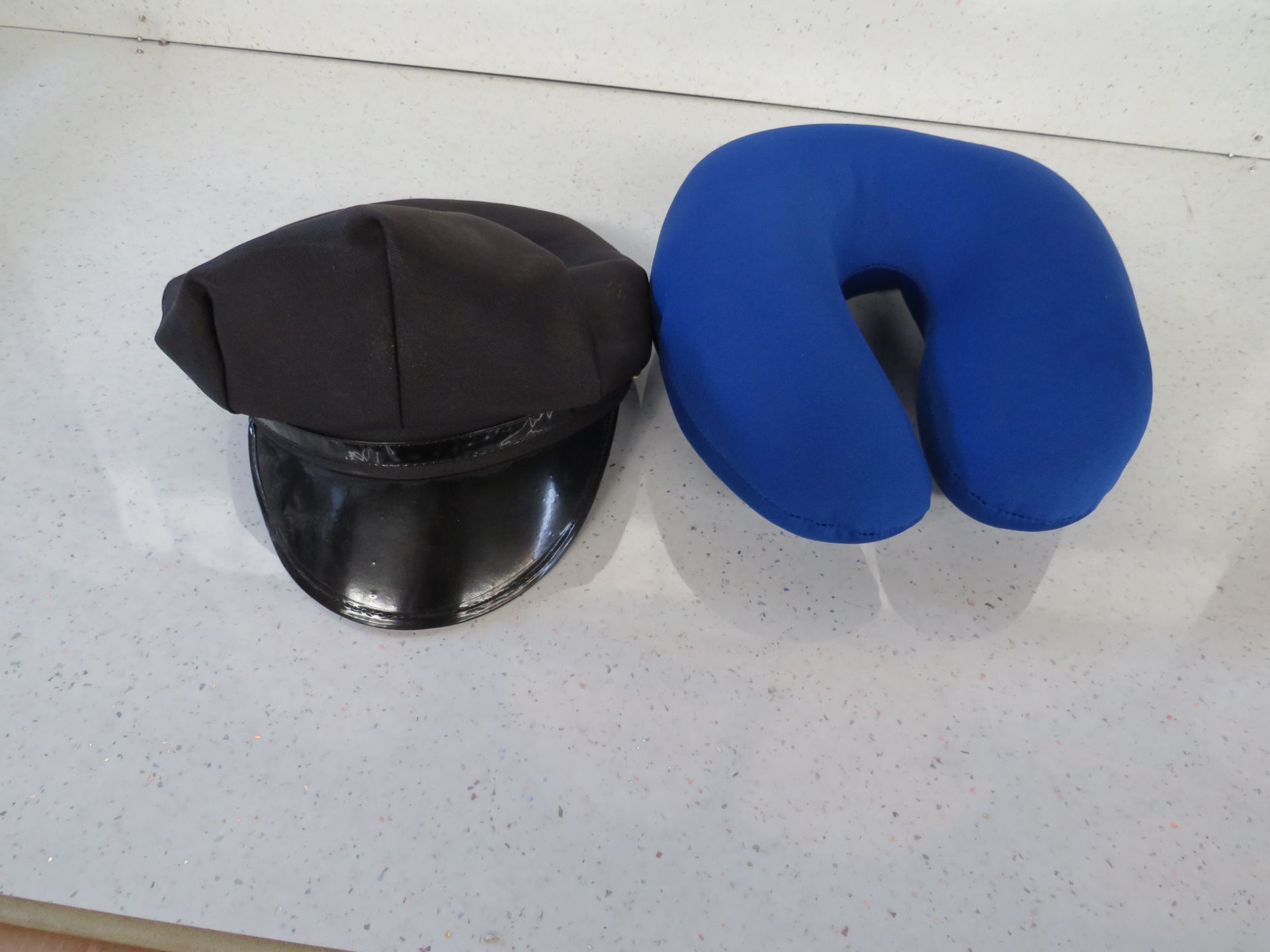 1x Novelty Black Hat - No Packaging. 1x Blue Neck Cushion - Non Original Packaging