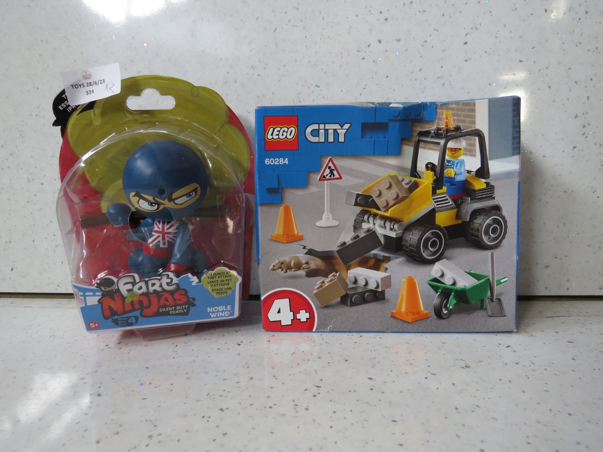 2 items being 1 x Fart Ninjas packaged & 1 x Lego City Dumper Truck set 60284 packaged both look