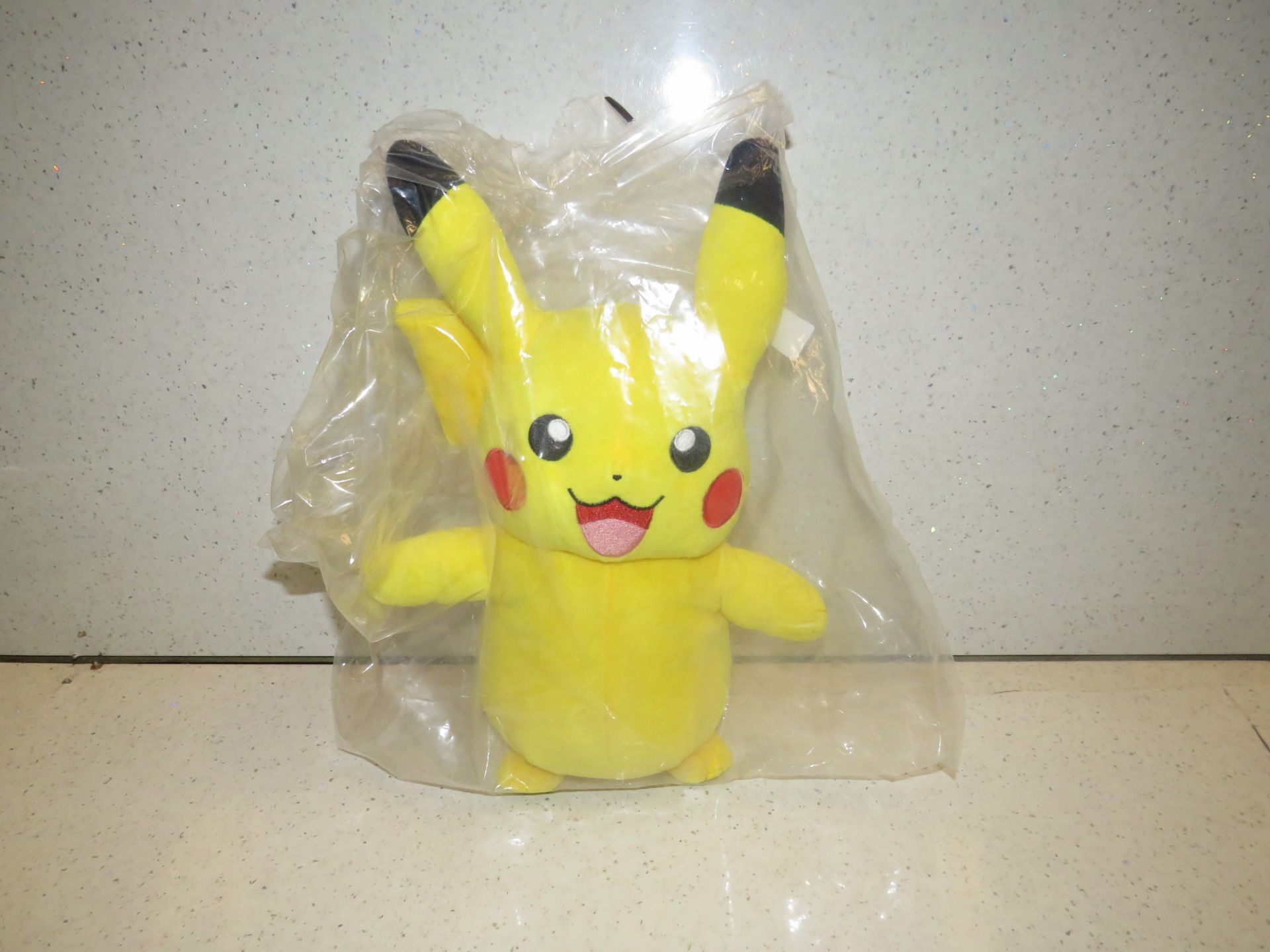 Pokemon pikachu - Good condition & Powers on, However the arms sometimes gets stuck moving.