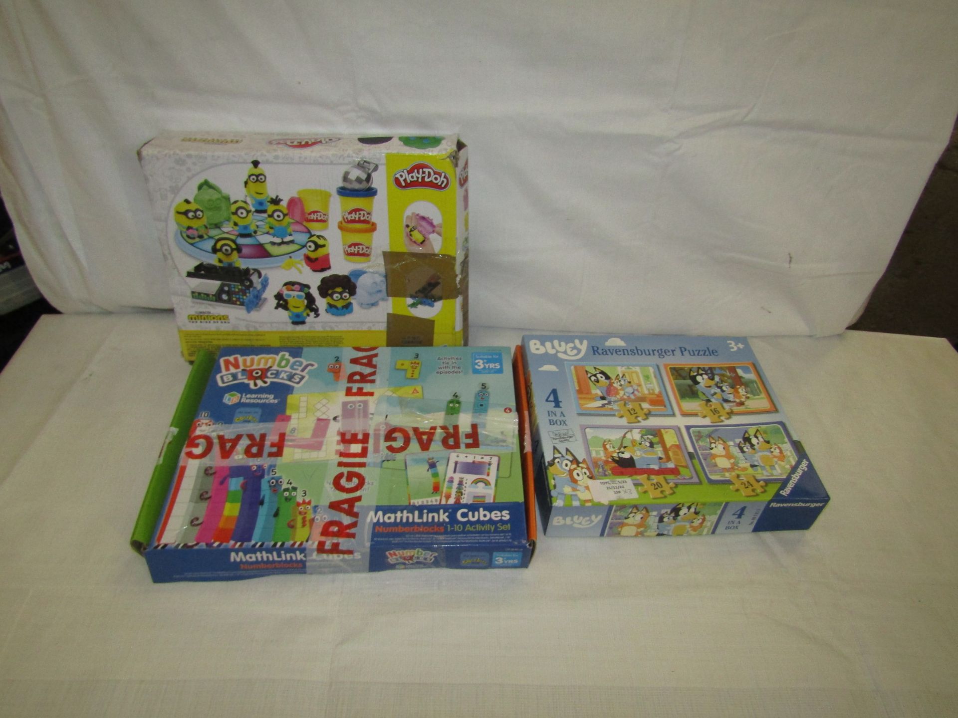1x Ravensburger - Bluey Set of 4 Puzzles - Unchecked & Boxed. 1x Hasbro - Play-Doh Minions Disco