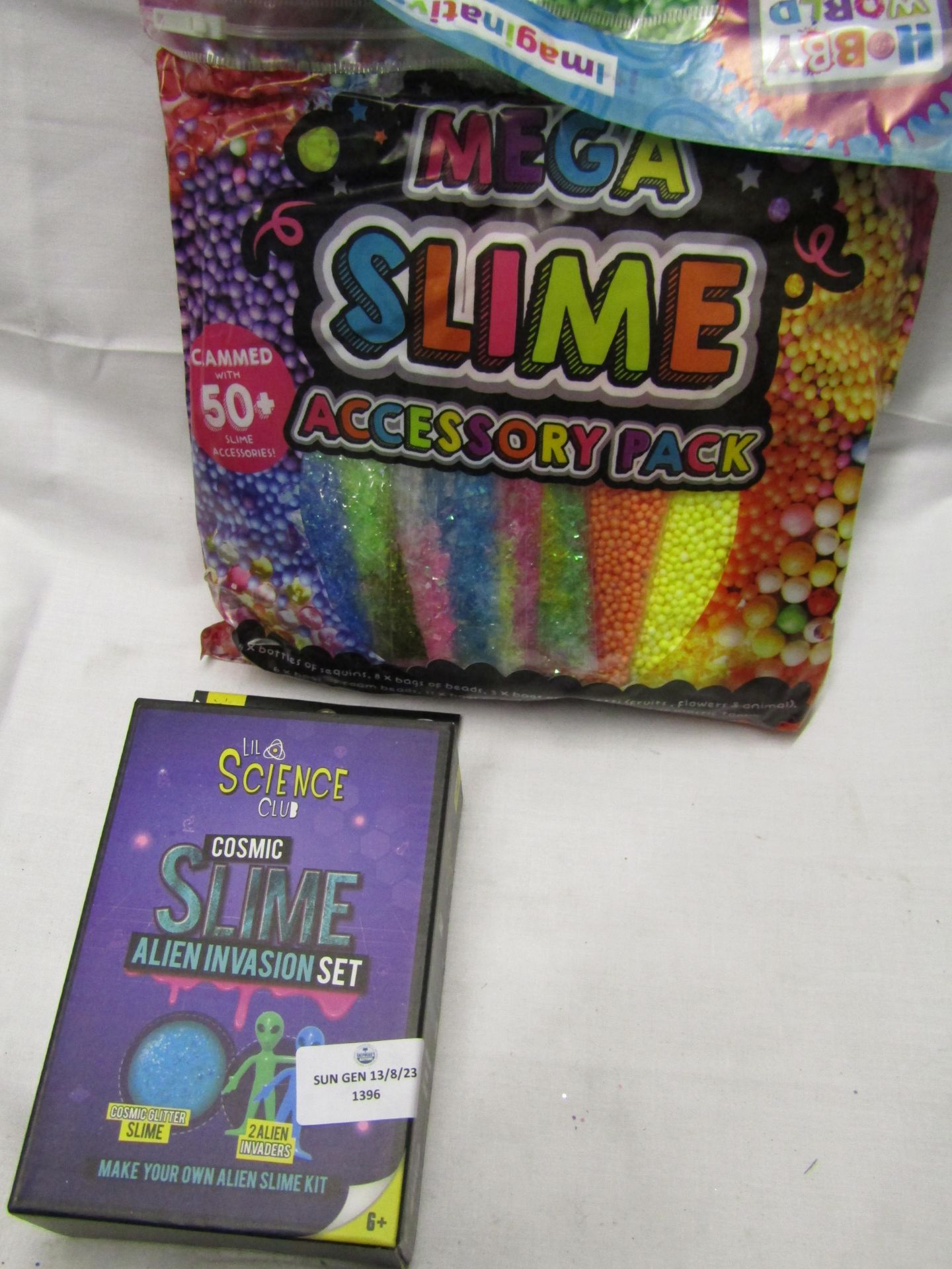 2 X Items being 1 X Make Your Own Alien Invasion Slime, & 1 X Bag of Mega Accessorys pack Both