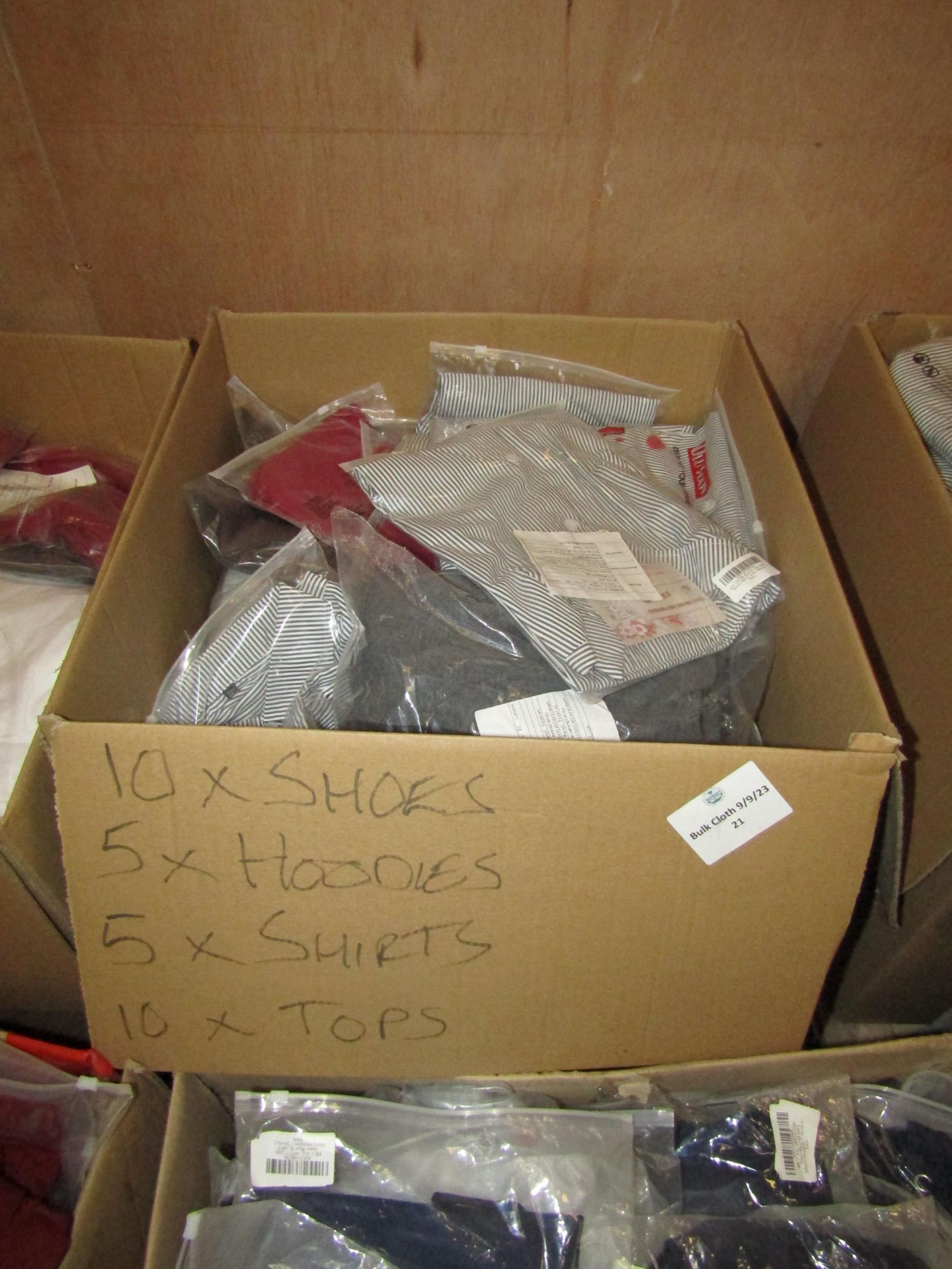 box of Mixed Amazon Shoes and and Clothing all new, consists of 10 shoes and 20 pieces of clothing
