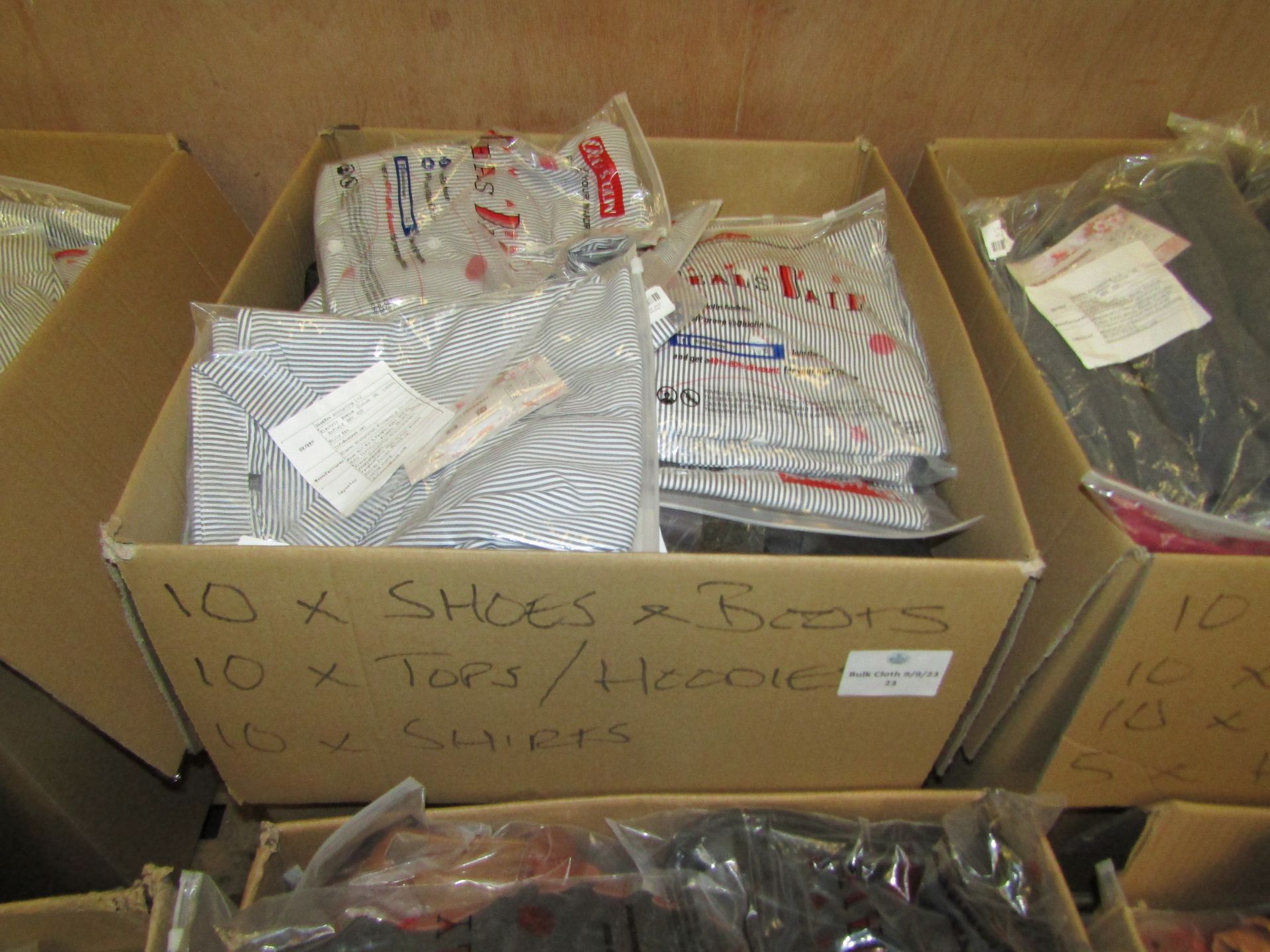 box of Mixed Amazon Shoes and and Clothing all new, consists of 10 shoes/boots and 20 pieces of