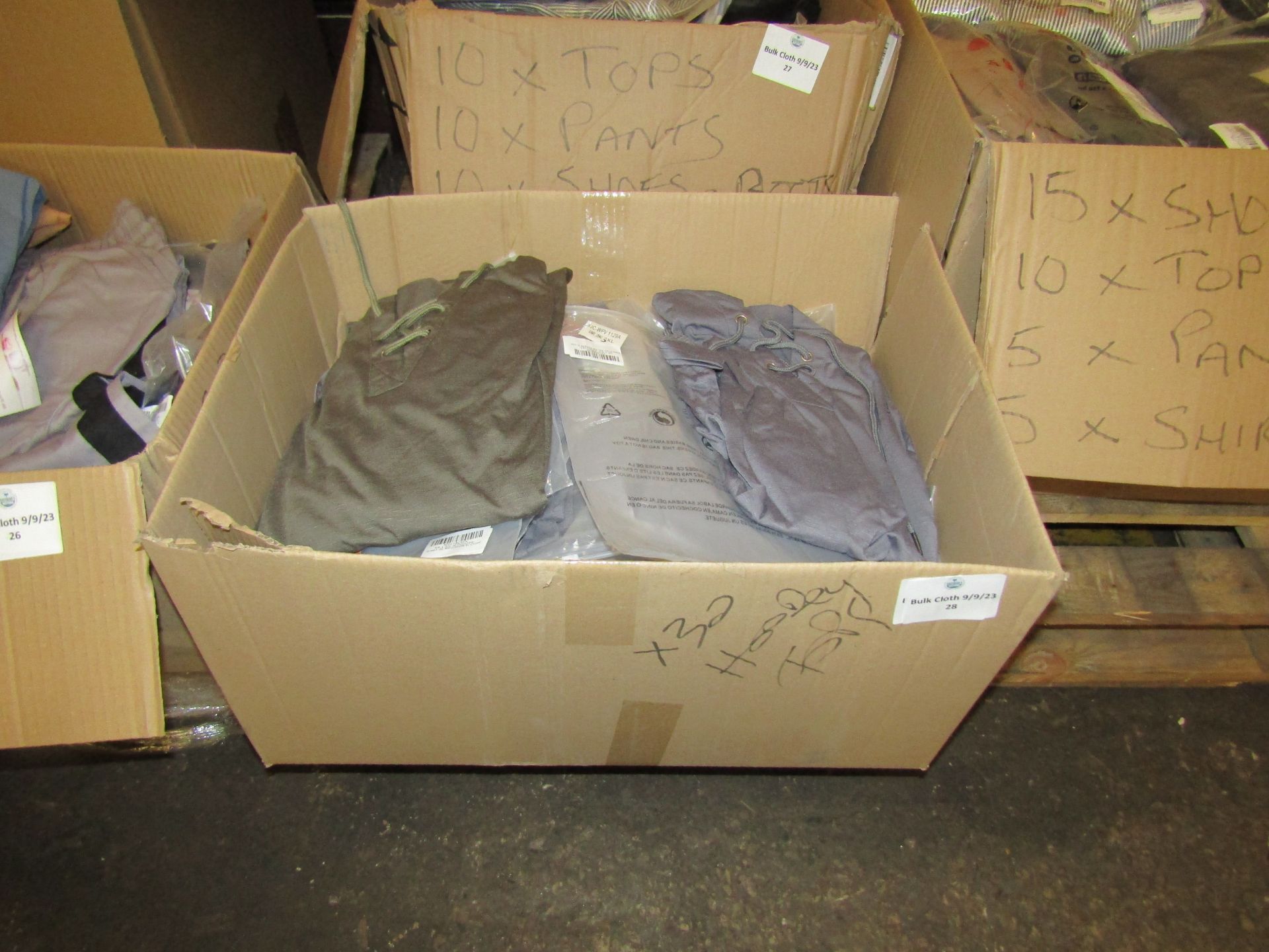 box of Mixed Amazon Shoes and and Clothing all new, consists of 30 pieces of clothing including tops