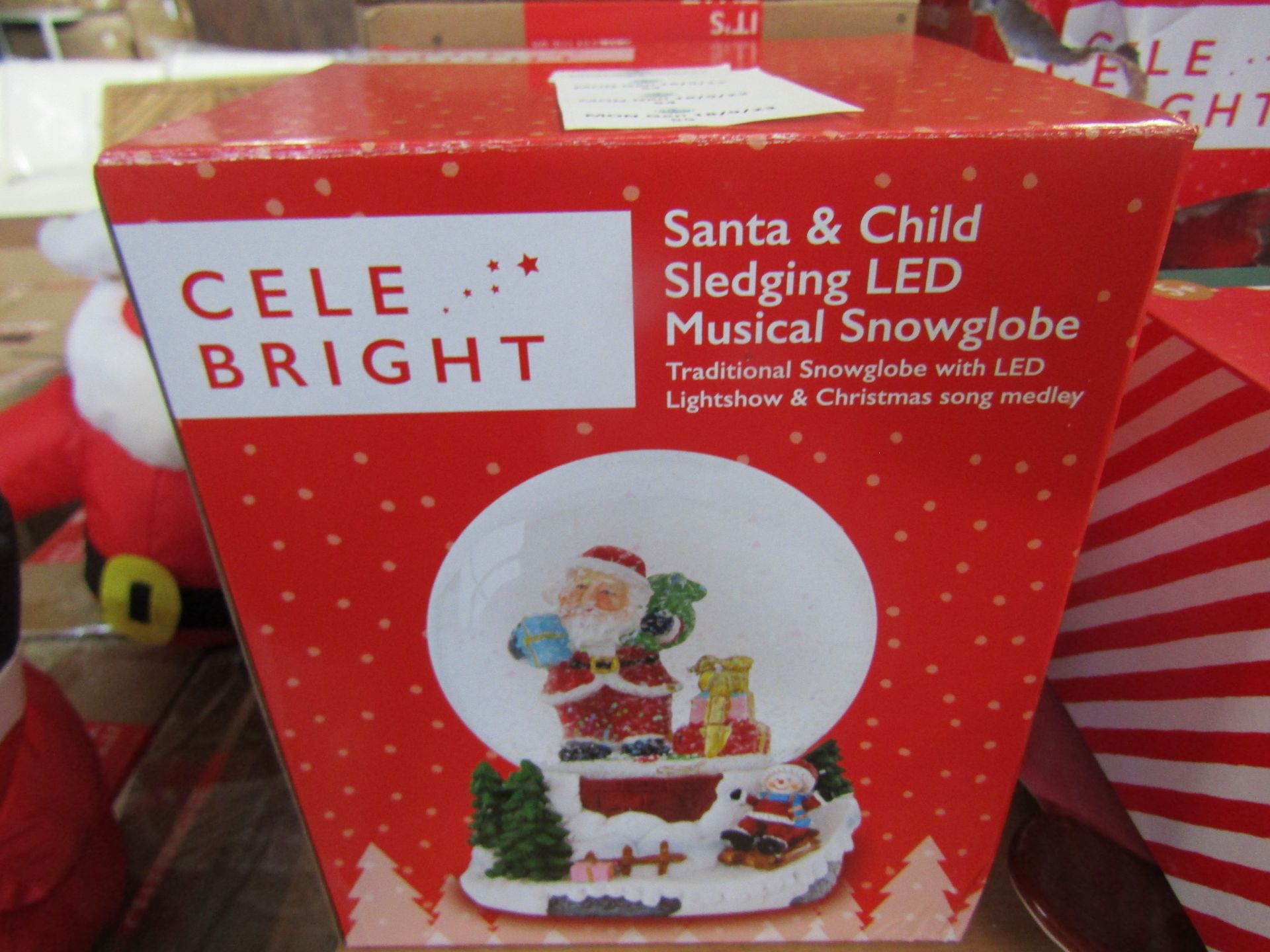 Celebright - Santa & Child Sledging LED Musical Snowglobe - Looks In Good Condition & Boxed.