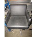 Large black leather office chair with caster wheels - No phsical damage visible just needs a good