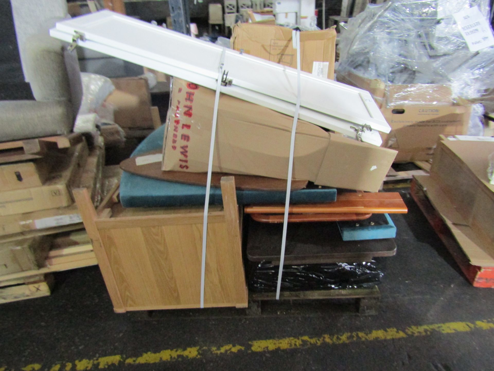 Pallet of unmanifested customer return furniture. All unchecked
