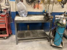 Steel framed workbench with bench mounted vice grip and workshop ancillary workshop equipment