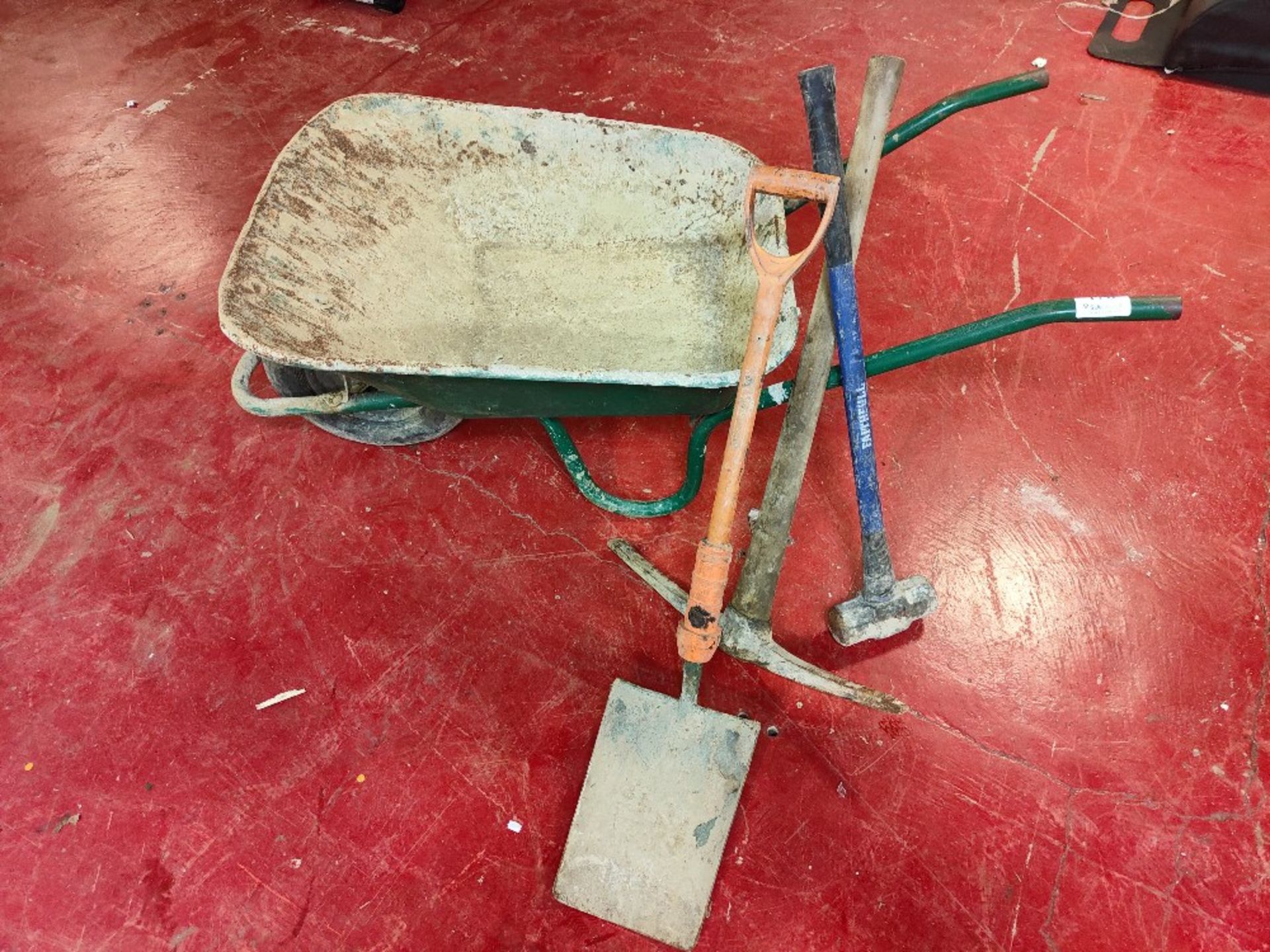 Wheelbarrow, sledge hammer, pick axe and shovel