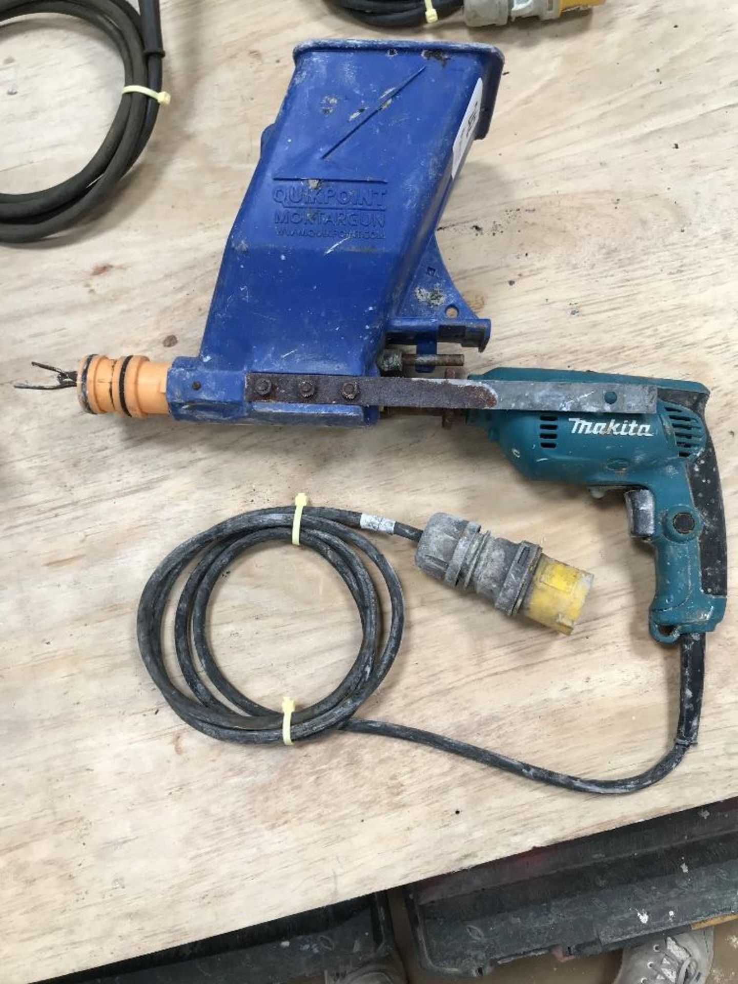 Makita 110v hand drill with Quikpoint Mortargun attachment