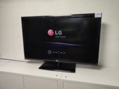 LG 42LD450 television with remote control and power cord