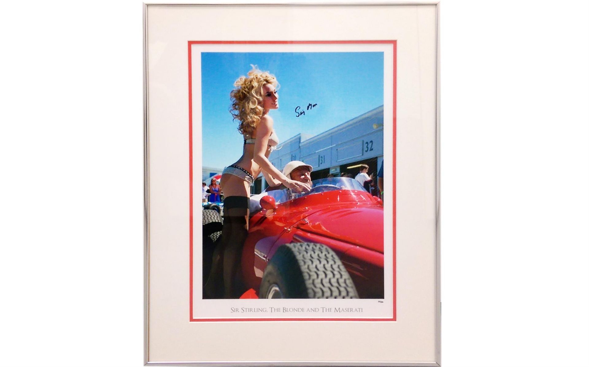 'Sir Stirling, the Blonde and the Maserati'. Signed by Sir Stirling Moss OBE