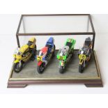 A Set of Four 1:12 Scale Moto GP Bikes from Tamyia Assembled and Cased.