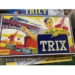 Two boxes of Trix system together with three part boxes of Meccano