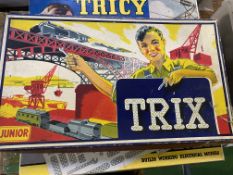 Two boxes of Trix system together with three part boxes of Meccano